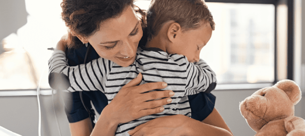 Mother hugging child