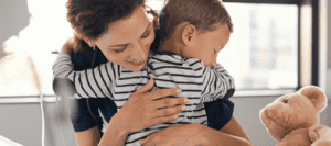 Mother hugging child