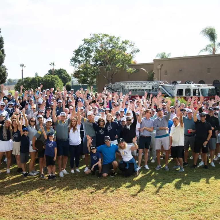 A group of people at the Will Strong Golf outing.