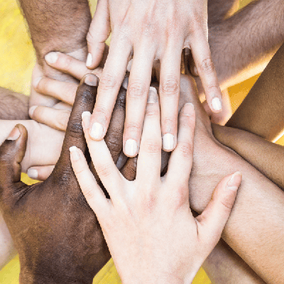 Hands of many different races joined together, representing the fight to end health inequity