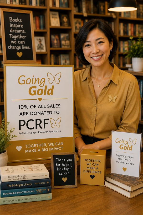 A business owner wearing a gold ribbon pin